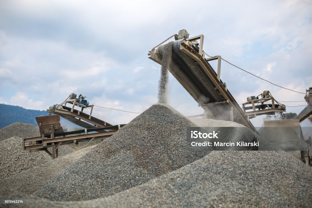 Home image of heavy machinery works at the quarry.