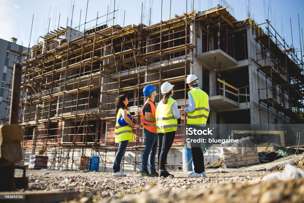 group of construction workers on building site.stock photo