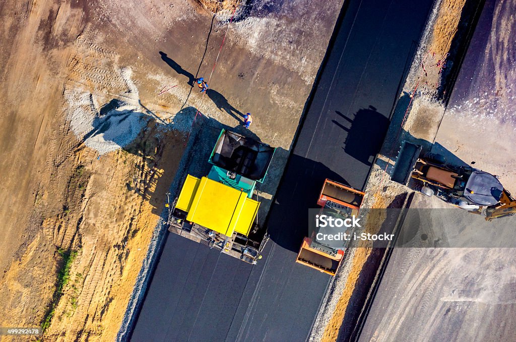 Home aerial view on the new asphalt road under construction