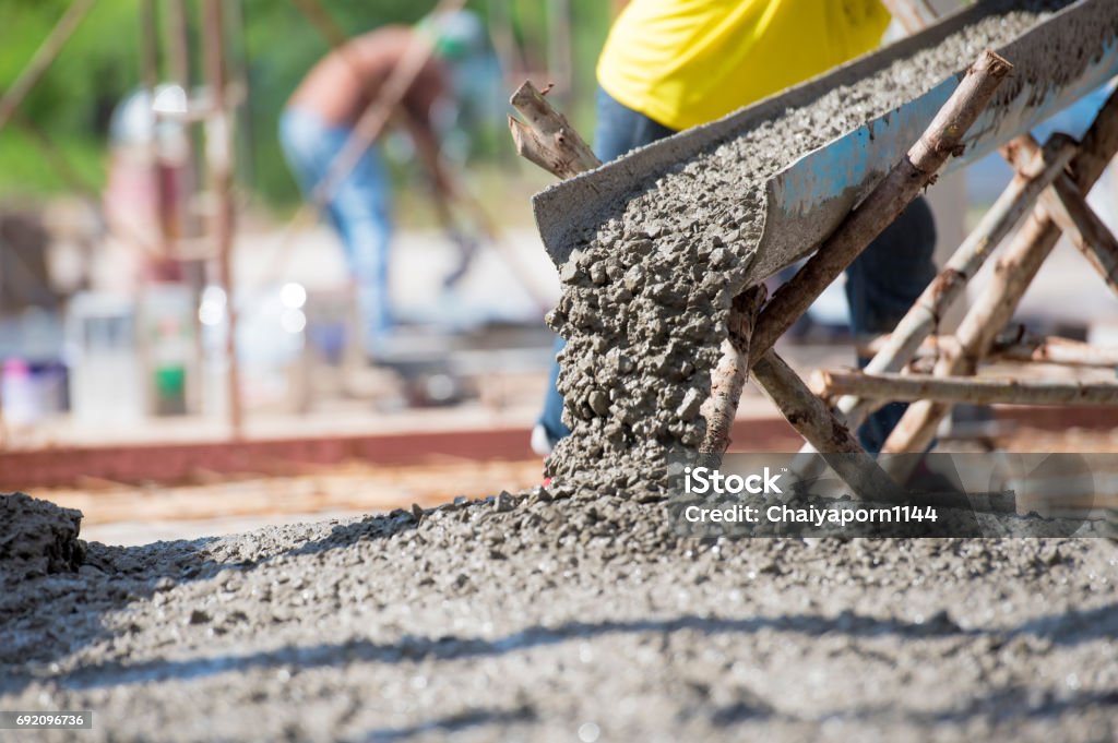 Home concrete pouring during commercial concreting floors of building